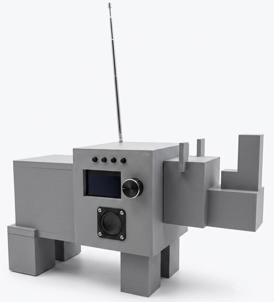 The finished Radio Rhino clock-radio, a 3D-printed rhinoceros with an OLED display, tuning knob, speaker, and telescoping antenna